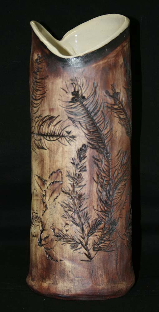 handbuilt-pottery-vase-with-leaf-impressions a pottery vase with leaf impressions made in our handbuilding class
