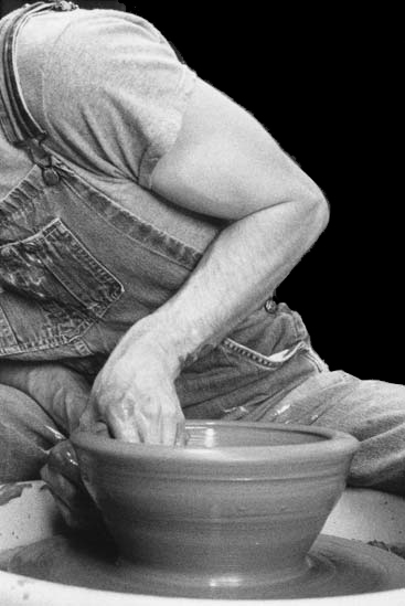 throwing a bowl on the potters wheel